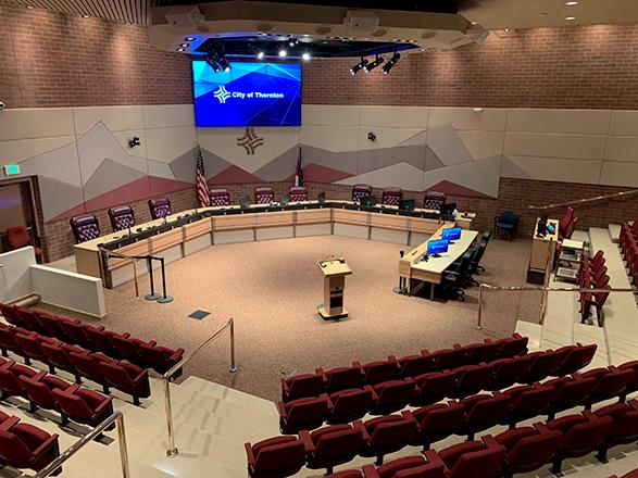 empty City Council Chambers with a screen