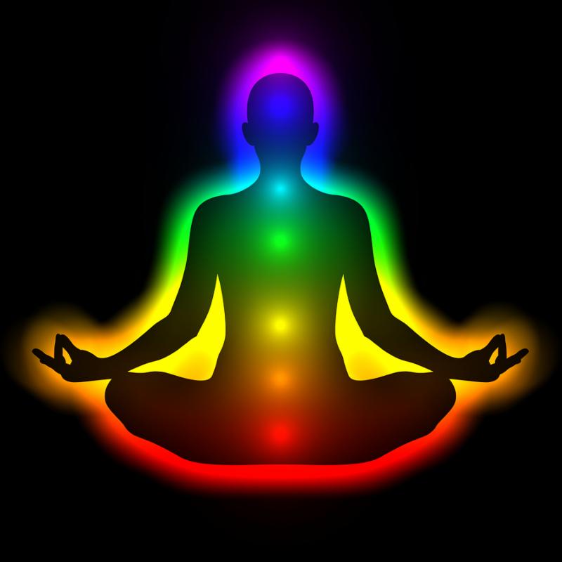 Illustration of silhouette of woman in meditation with aura and chakras. Theme of healing energy connection between the body and soul.