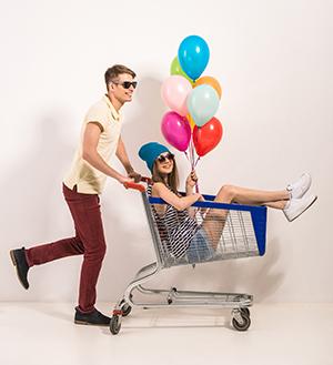 Couple with Balloons in a Shopping Cart