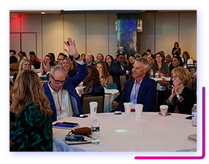 A room full of attendees seated during a session for the 2022 Catalyst Awards.