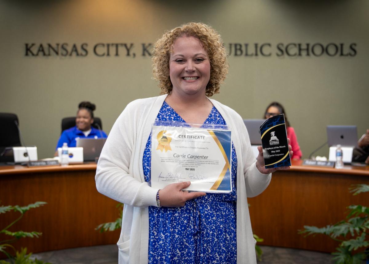 Teacher Carrie Carpenter poses for Employee of the Month photo