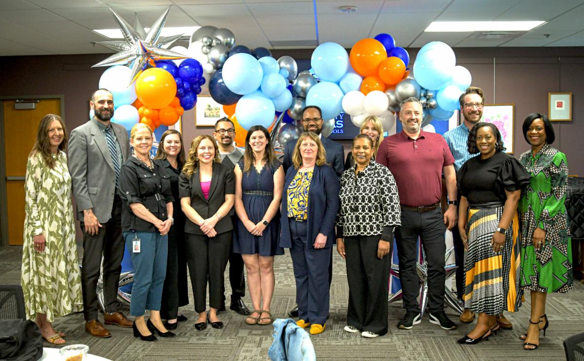 Ten aspiring principals and their mentors for the KCKPS pose for a photo 