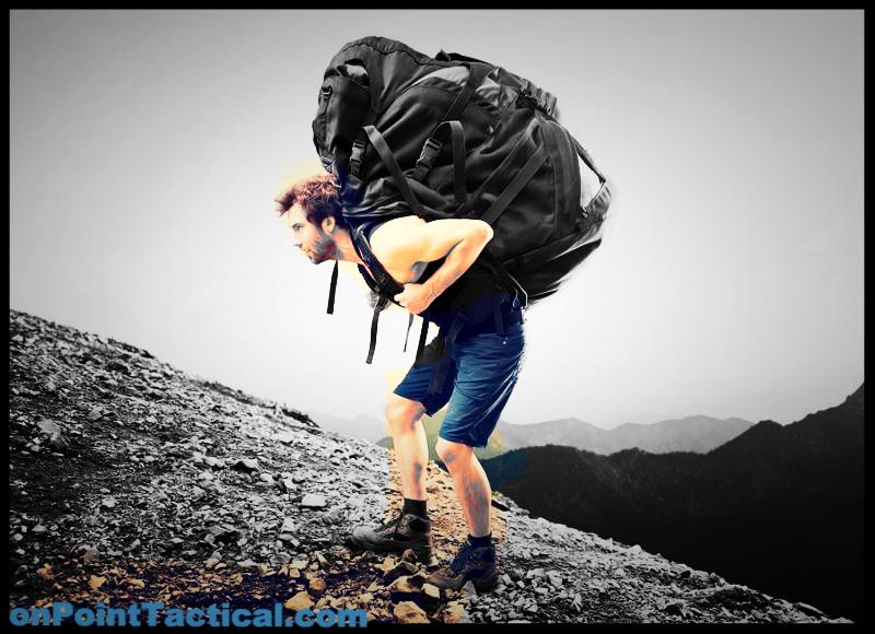hiker carries a heavy and big backpack
