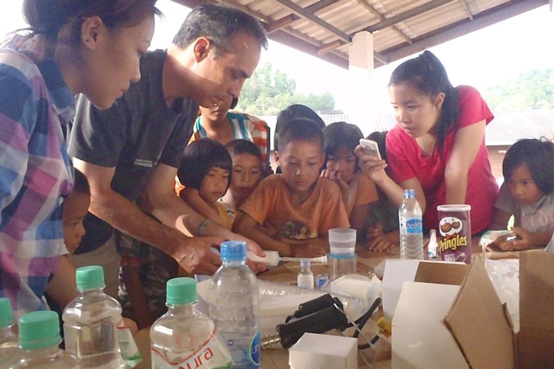 Phil Thompson, PhD, with a group of students and faculty in Thailand.