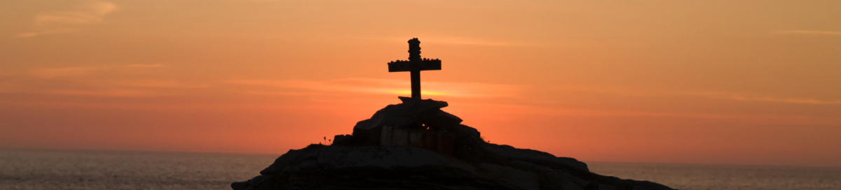 Cross visible in front of setting sun.