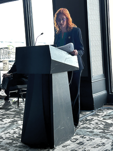 Annmarie Carmody presenting at the podium