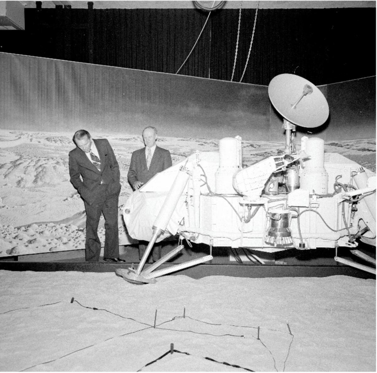 Two men check out the full-scale Viking lander on display at JPL in March 1976.