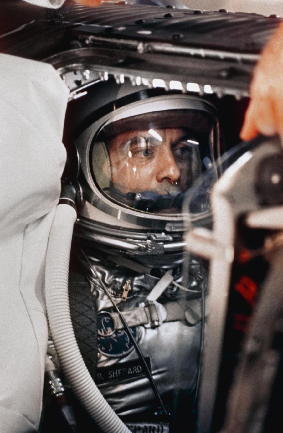 Mercury Redstone 3 astronaut Alan Shepard inside his spacecraft wearing his space suit.