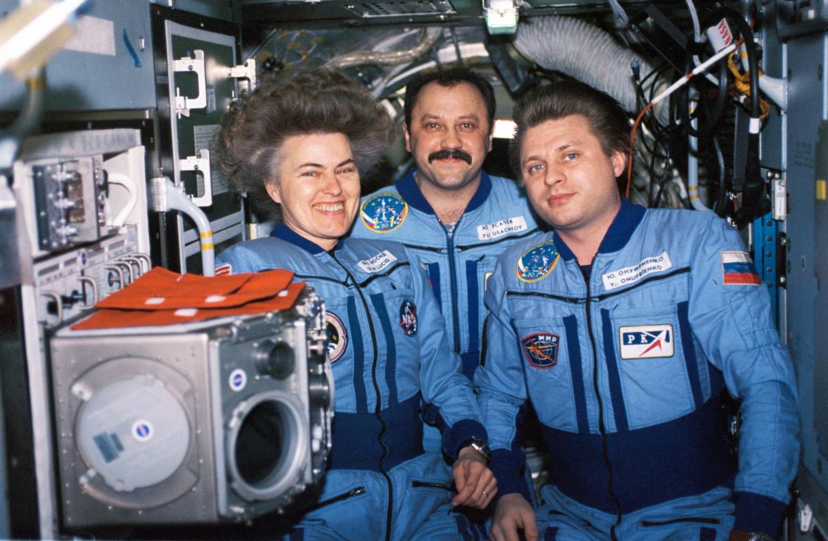 Shannon Lucid, Yury Usachev and Yuri Onufriyenko pose together in Mir's Priroda module
