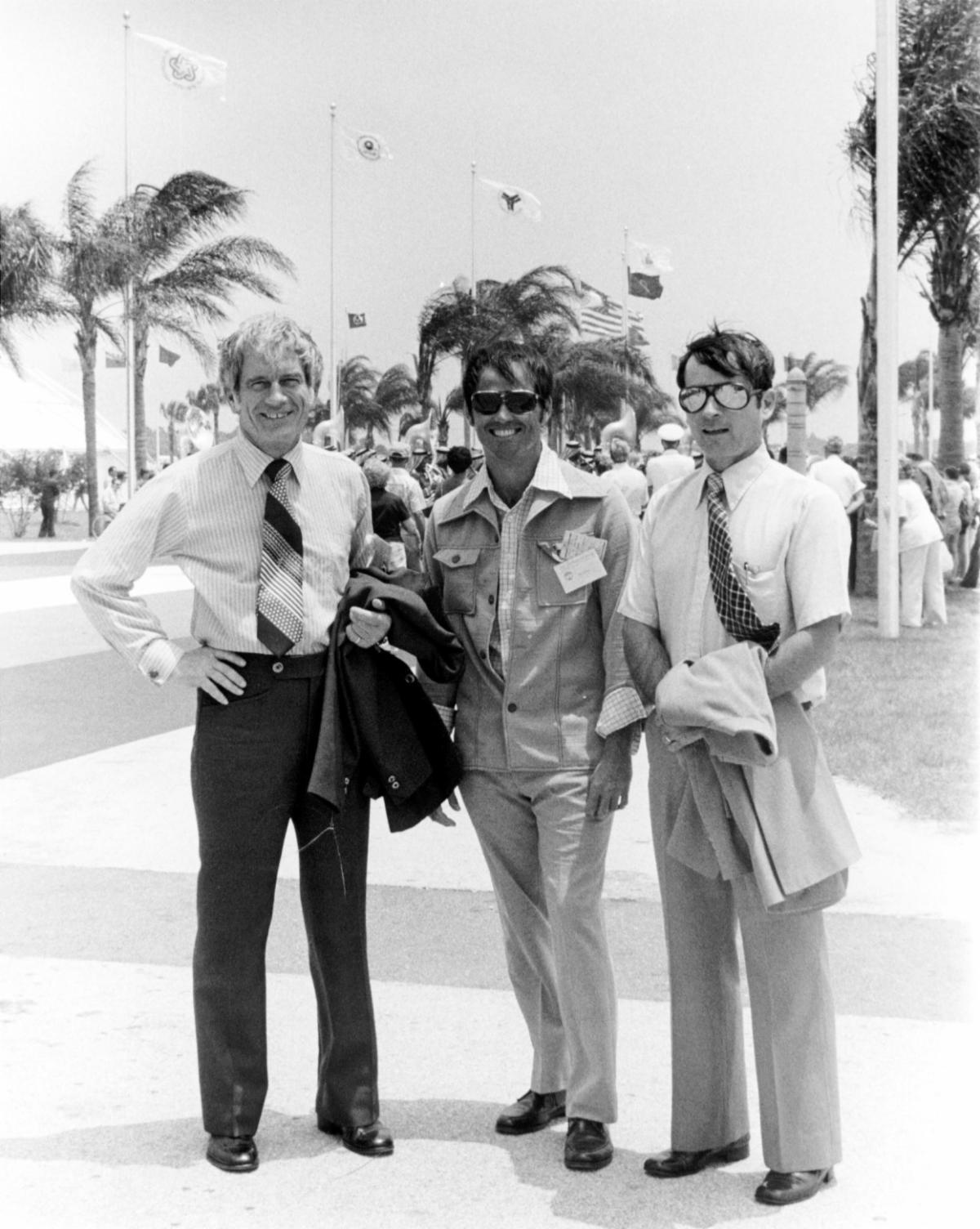 Deke Slayton, Bob Crippen, and John Young pose together at Kennedy Space Center