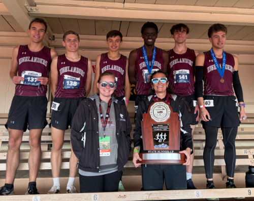 Boys cross country team with coaches and trophy