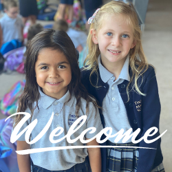 Two Lower School girls looking into camer with word welcome 
