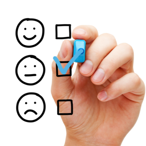 Photo of a hand checking off a box in a satisfaction survey