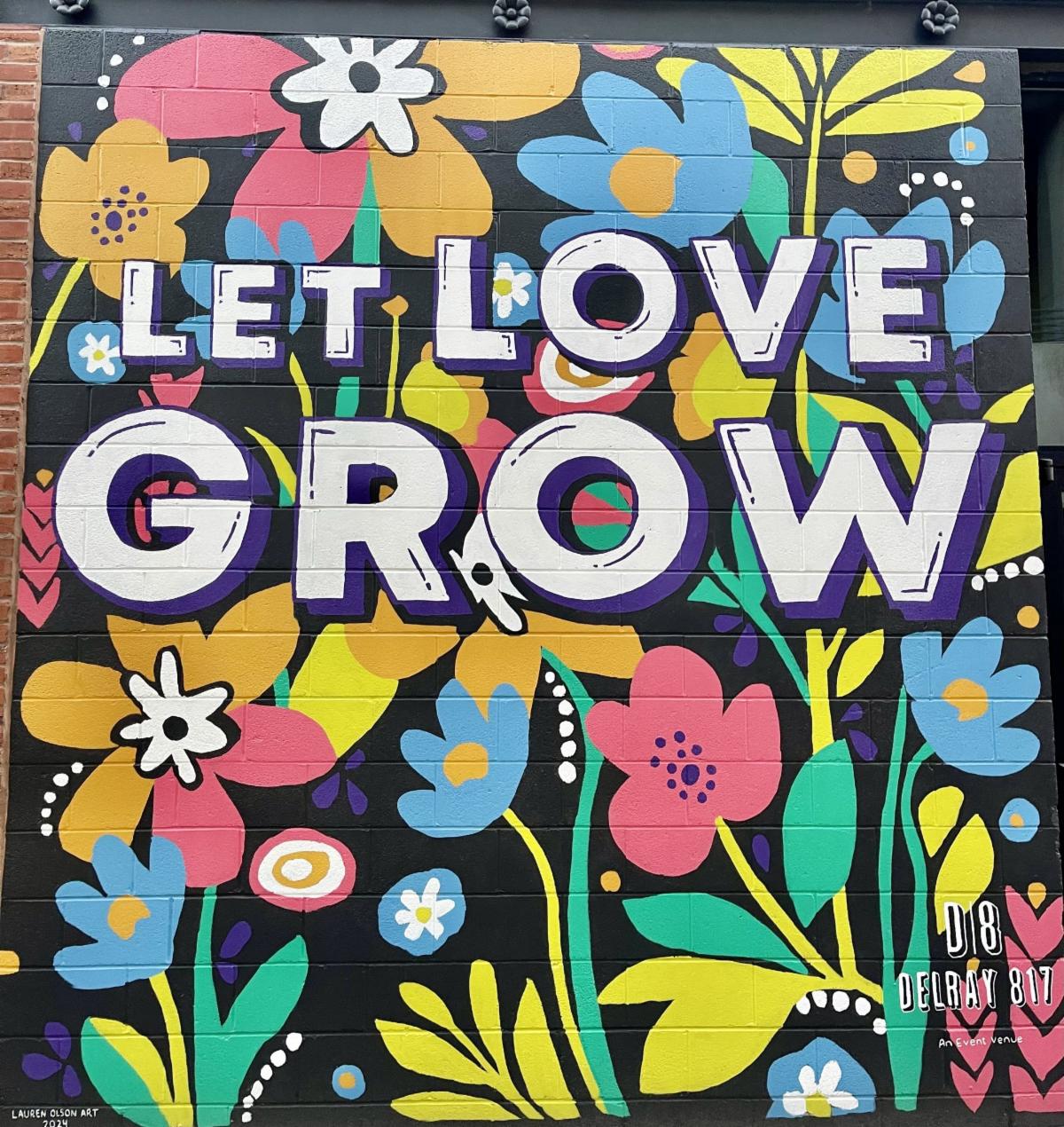 Photo taken by Nigel Fields of a newly painted 2024 mural designed by Annsley Cook and completed by Lauren Olsen Art in Lincoln, NE.