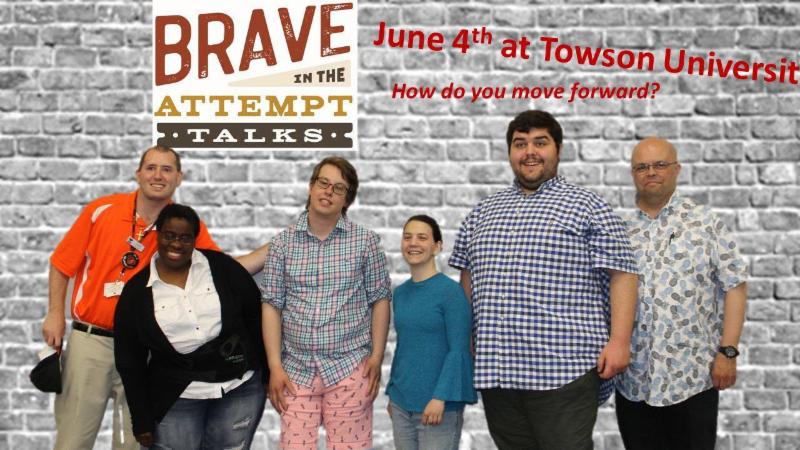 Group of six stand in front of wall with _Brave in the Attempt June 4th Towson University_ behind them. 