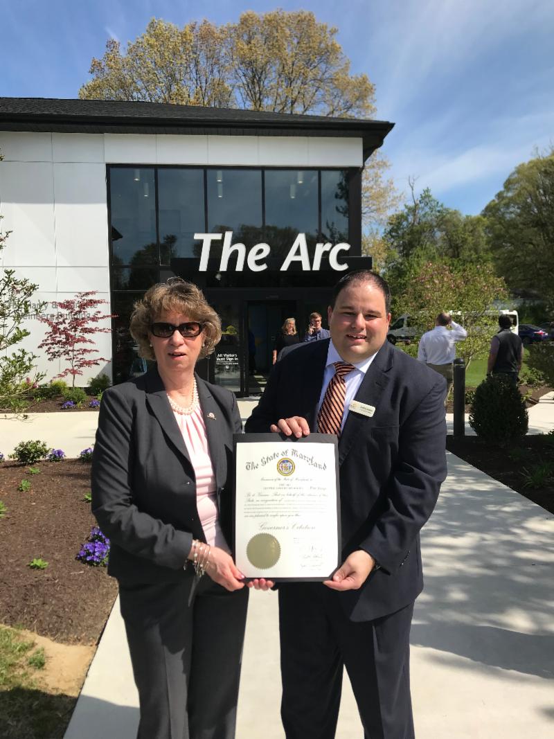 Sec Beatty holds Governor_s Citation with Jonathan Rondeau