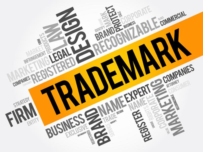 Trademark word cloud collage business concept background