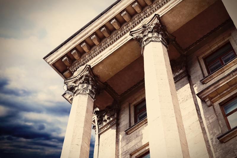 Courthouse facade with columns. Vintage style filter