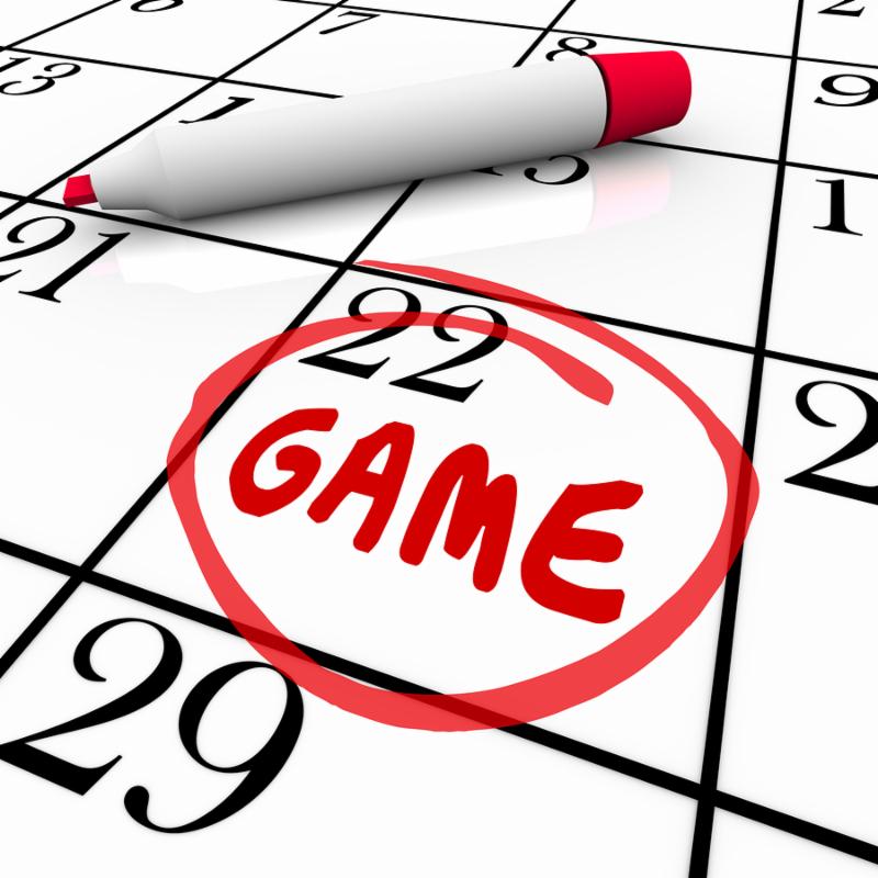 Game day or date circled with red pen or marker on a calendar or schedule as a reminder of the big event or competition