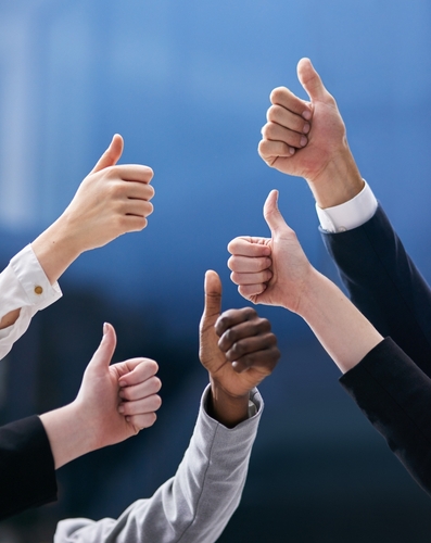 Hands_ thumbs up and business people in office with thank you_ welcome or success sign on blue background. Support_ vote or team with service review_ feedback or winning sign for solidarity and trust