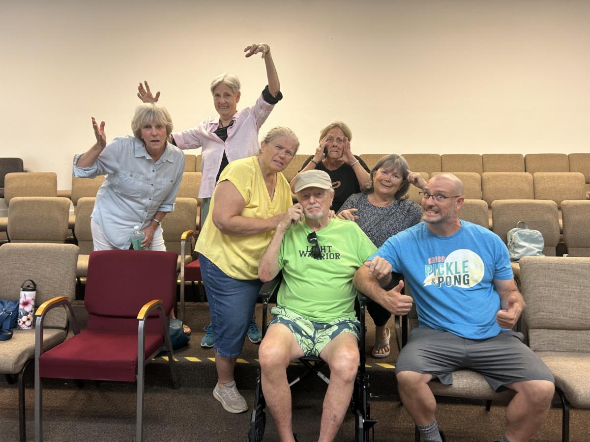 A group of improv actors looking confused