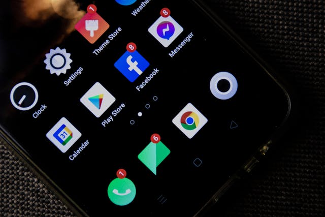 a phone screen showing multiple apps with notifications