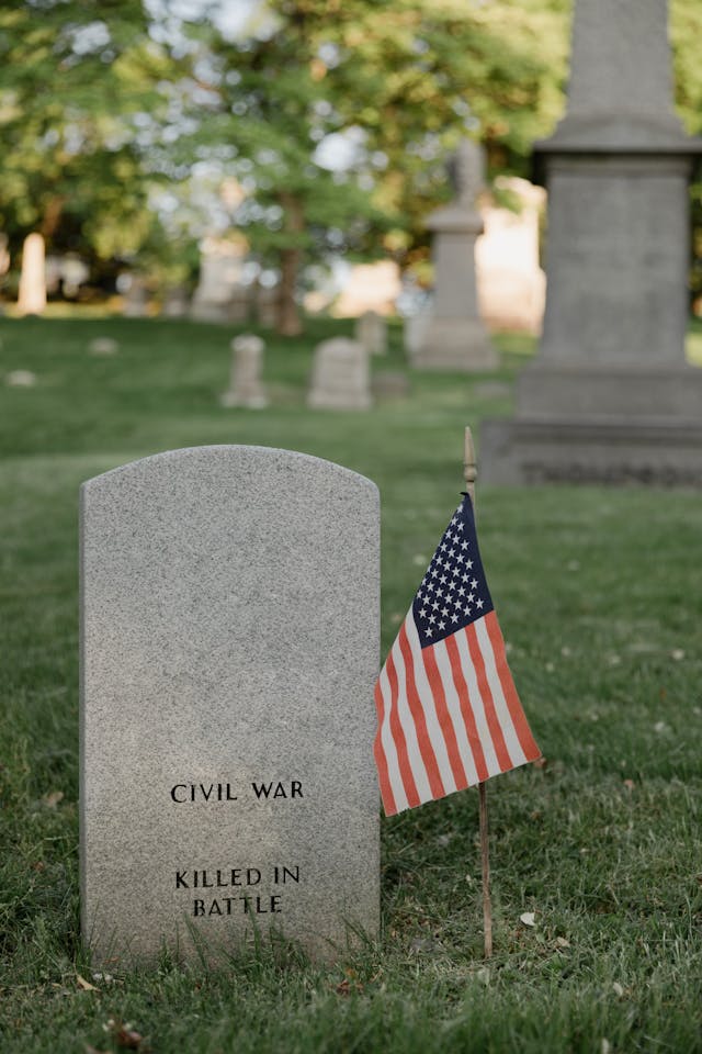 A US flag next to a Civil War gravestone
