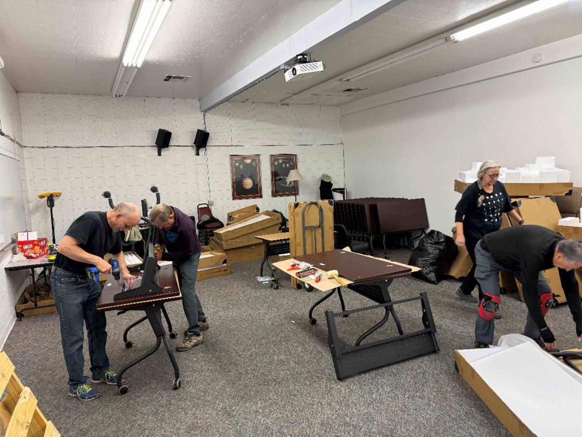 volunteers assembling tables
