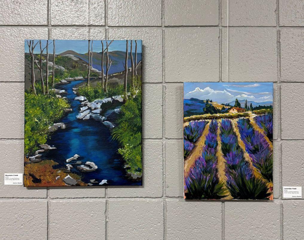 Two of Jessica Beattie's acrylic paintings hanging in the OLLI Art Gallery