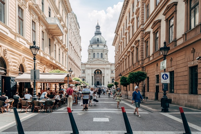 a view of the Hungarian Parliament building through a narrow street in Budapest Hungary
