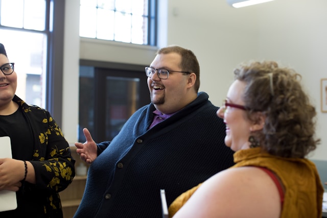 Fat people having a conversation and laughing together