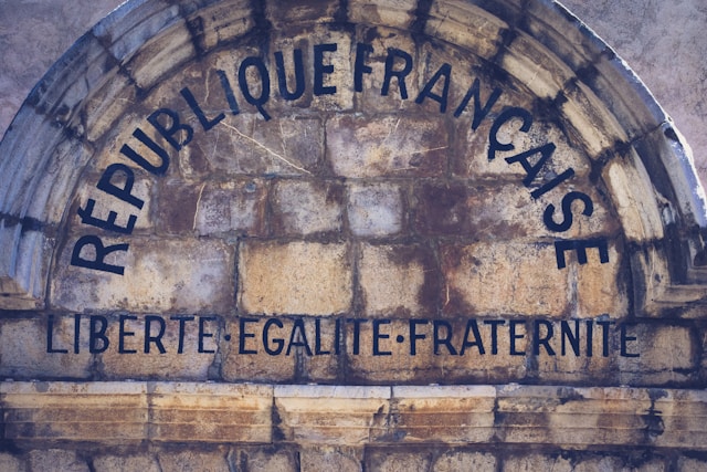 A wall with a French sign