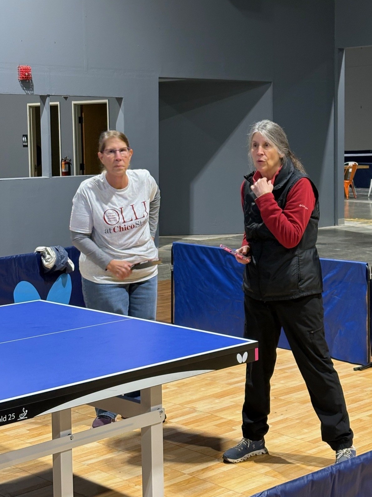 OLLI members playing ping pong