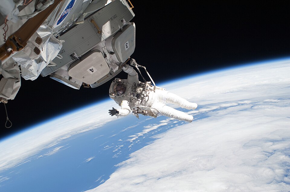 an astronaut on a space walk with the Earth in the background