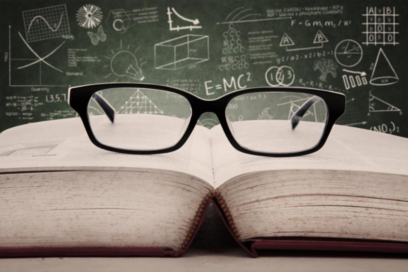 glasses on open book