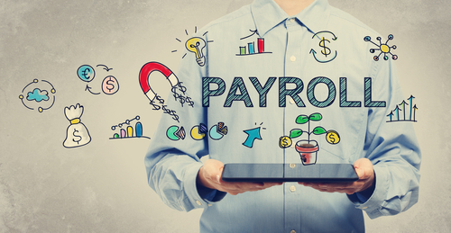 Payroll concept with young man holding a tablet computer 