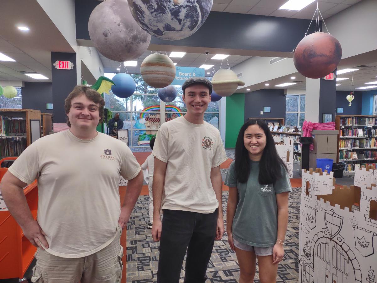 Josiah Yarborough (center) with CKI-AU team members.