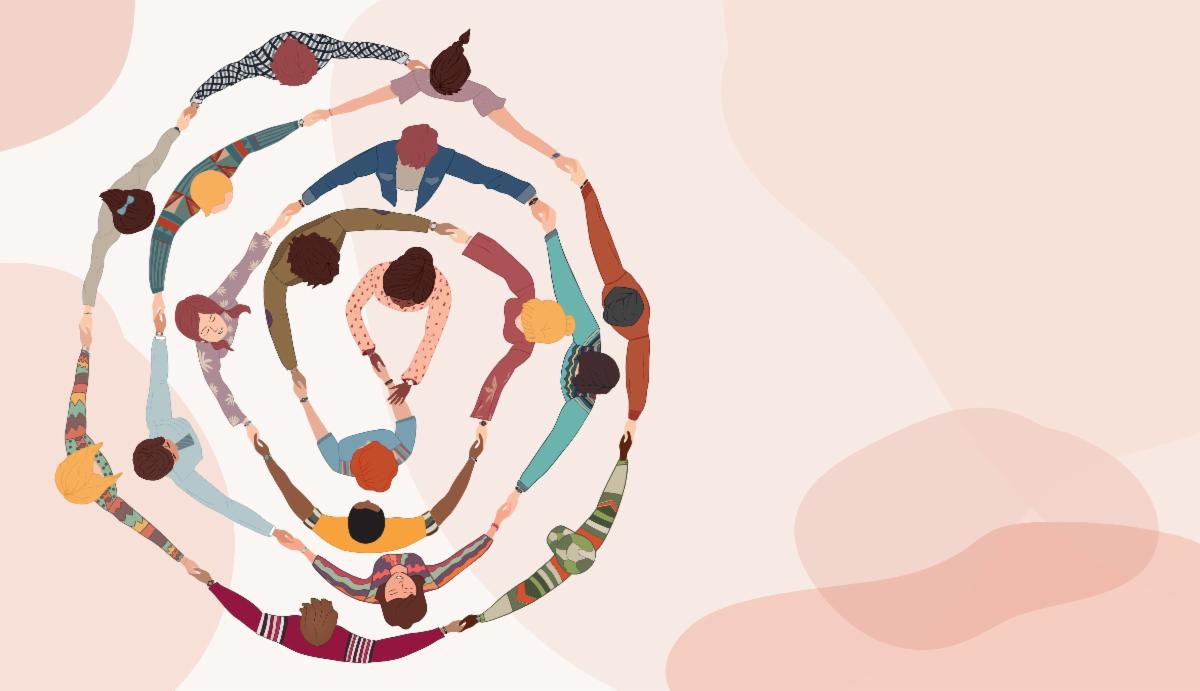 Group of diverse people holding hands in a circle.