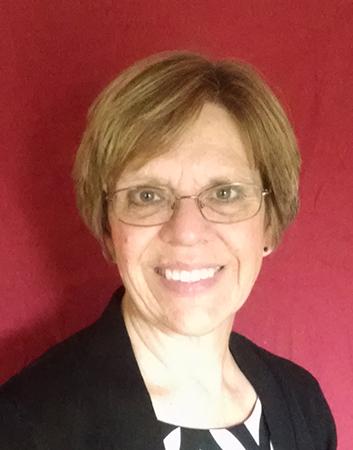 A smiling woman on a red background