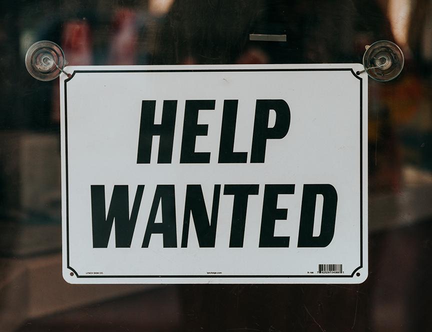 help wanted sign on glass door