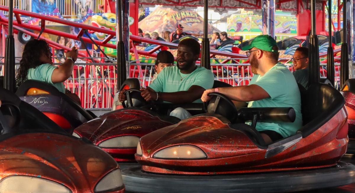Transfer Ambassadors taking a selfie on bumper carts
