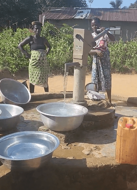 Residents of Sasstown, Liberia, use a newly functioning water well that was repaired and rehabilitated by the Sayeh Foundation