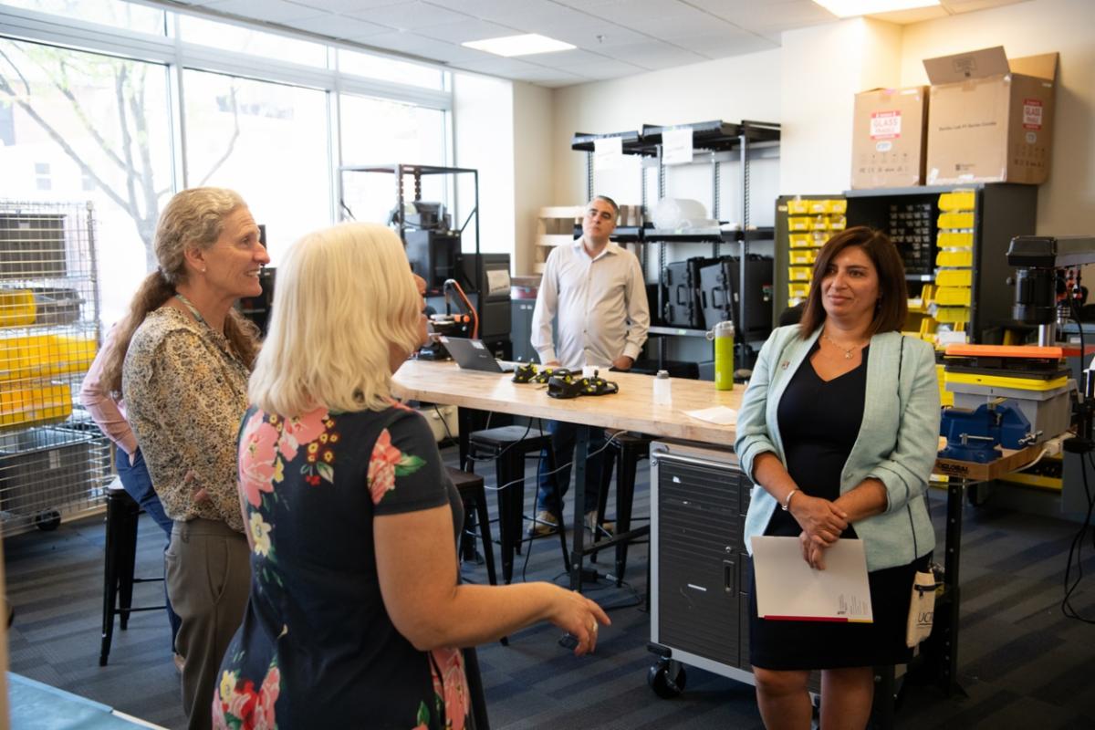 Faculty from UMB lead a faculty from the University of Costa Rica on a tour of Next Step Robotics