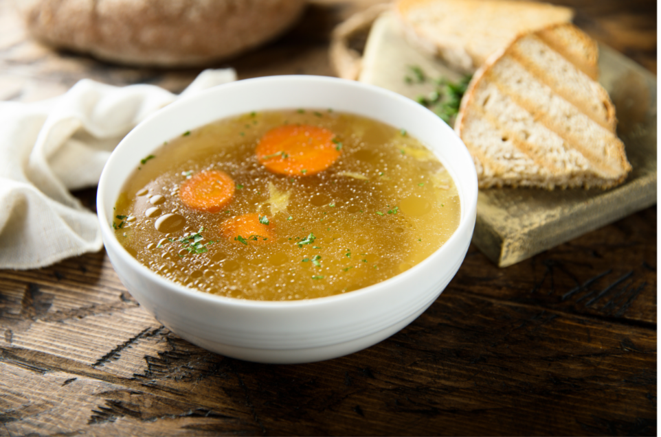 Bowl of vegetable broth in it