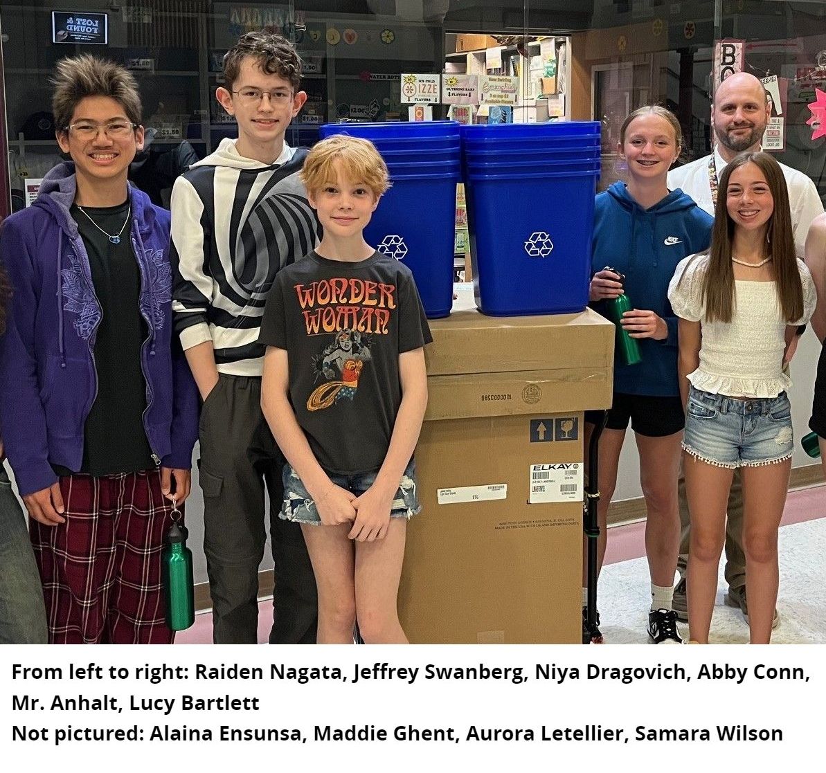 Youth and teacher next to water bottle refilling station