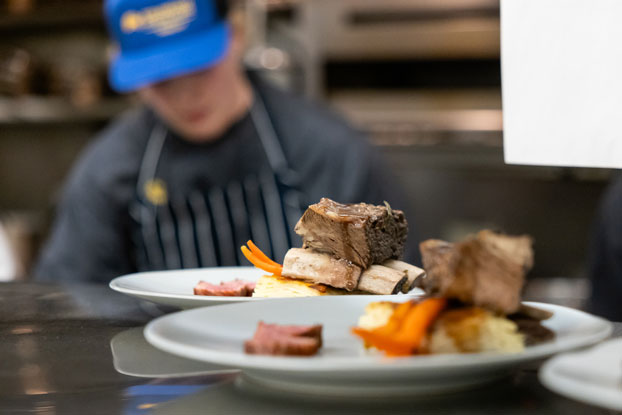 Student chefs prepare the first course