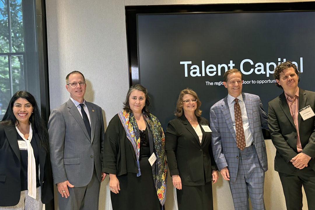 Group of 6 professionals with words Talent Capital behind them