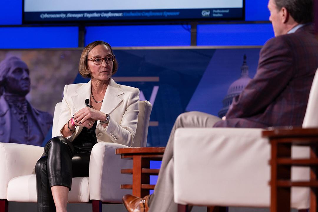 AI can be helpful in meeting some of the cybersecurity challenges ahead, keynote speaker Amy Gilliland told Roger Cressey. (Sarah Hochstein/GW Today)