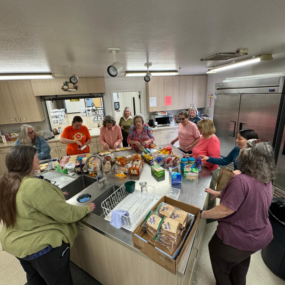 volunteers making lunches for youth hope on may 22 2024