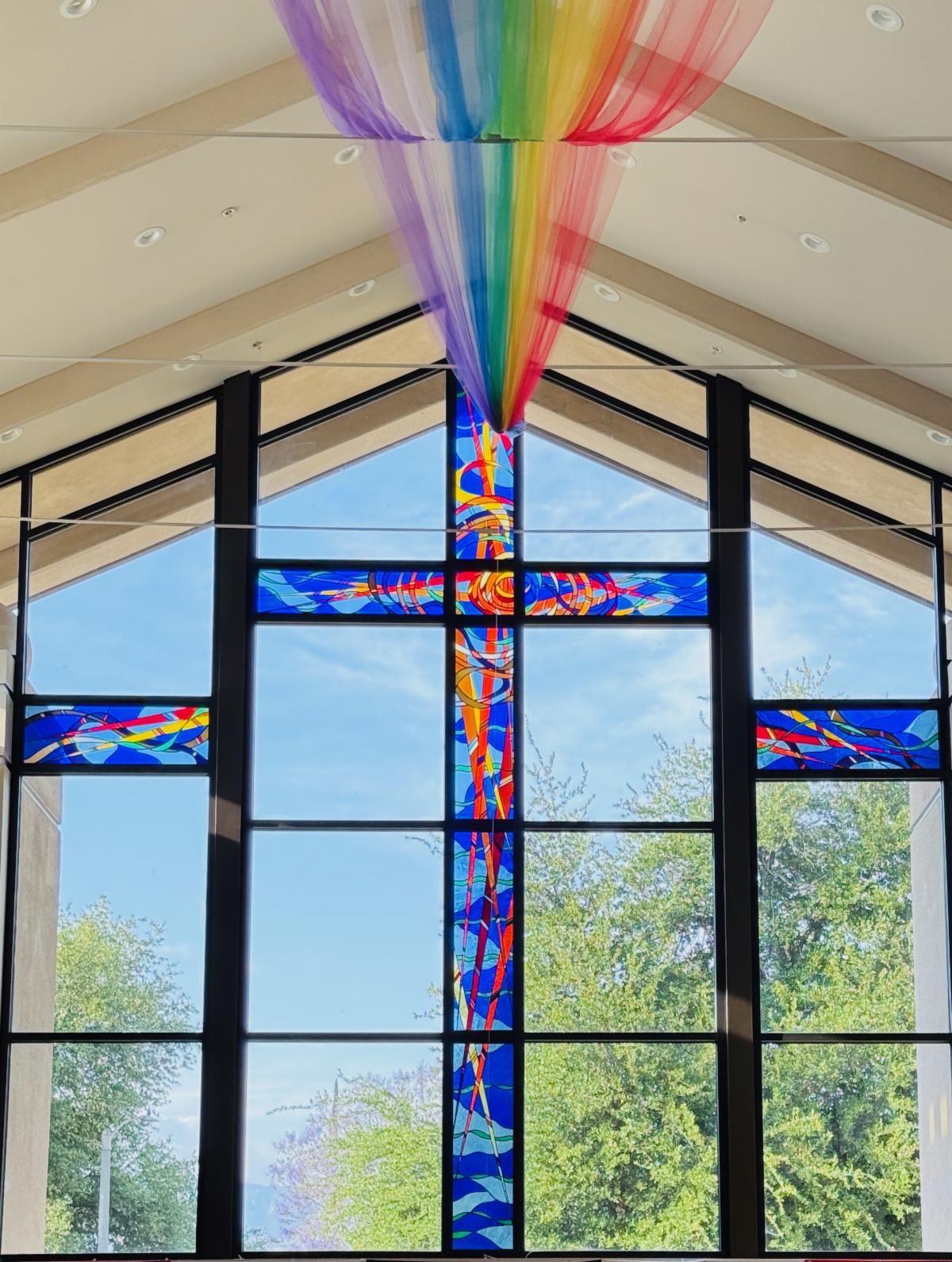 RUCC stained glass with rainbow